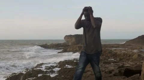 A frustrated black guy at the beach 02 Видео 67556562