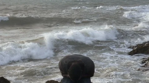 A frustrated black guy at the beach 04 Stock Footage 67556824