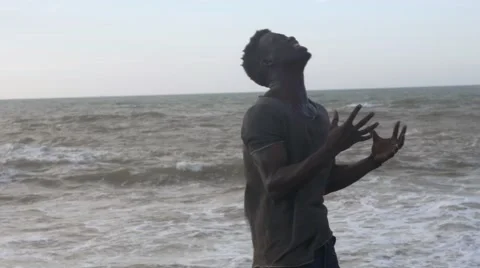 A frustrated black guy at the beach 07 Video stock 67556547
