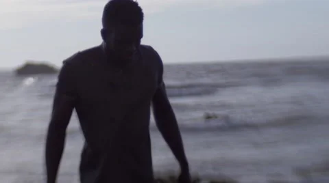 A frustrated black guy at the beach 09 Stock Footage 67522975