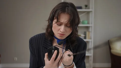 Frustrated call center agent strangling a computer mouse Stock Footage 327940728