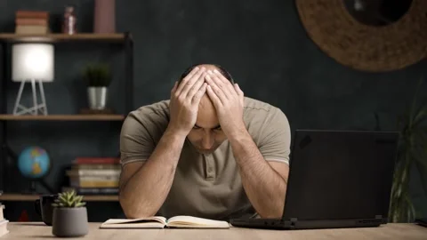 Frustrated Caucasian Businessman Having a Headache or Bad News in Home Office Stock Footage 342236853