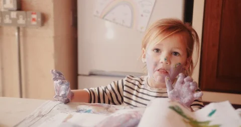 Frustrated child dirty with paints having a tantrum Stock Footage
