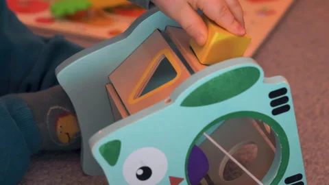 Frustrated Child Throwing Yellow Block Away From Shape Sorter Stock Footage 329325052