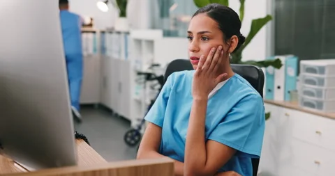 Frustrated, computer or nurse in hospital with issue, booking error or Stock Footage 346448557