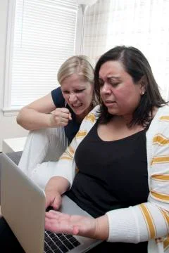 Frustrated computer pair Stock Photos