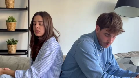 Frustrated couple arguing during relationship crisis at home Stock Footage 335588210