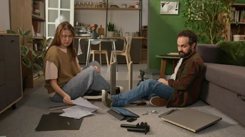 Frustrated Couple Fitting on Wrong Component while Assembling Cabinet Stock-Footage 330510794