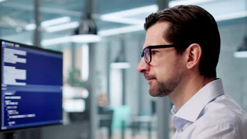 Frustrated Developer Looks At Computer Screen After Coding Mistake Stock Footage 334537604