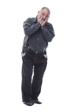 Frustrated elderly man with empty pockets. isolated on a white Fotos Stock