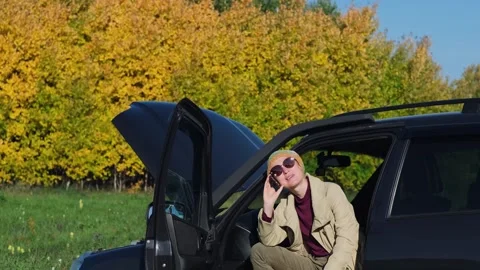 A frustrated female driver calling roadside service insurance. Stock-Footage 262424006