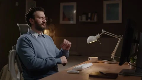 Frustrated freelancer, failure. Man working on computer is upset by what he sees Stock Footage 337645594