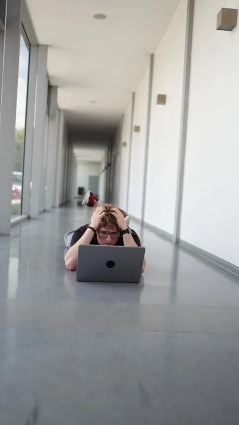 Frustrated freelancer on floor Stock Footage 337851160