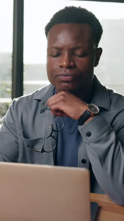 Frustrated, glasses or black man with laptop in office, negative project Stock Footage 333699626
