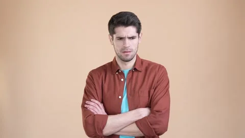 Frustrated guy break up offense cross arms isolated pastel color background Stock Footage 169939002