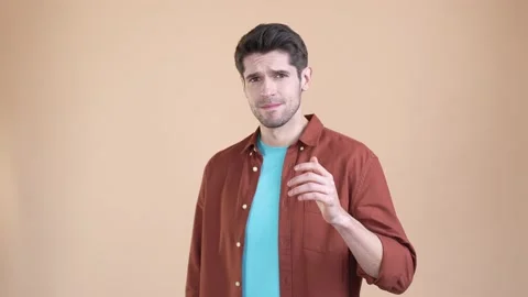 Frustrated guy no hear confidential novelty isolated pastel color background Stock Footage 169938053