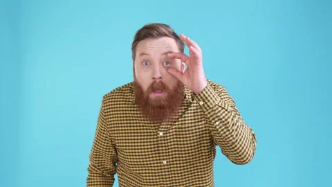 Frustrated guy no see need glasses isolated blue color background Stock Footage 187781800
