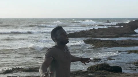 Frustrated guy shouting at the beach area Stock Footage 67556388