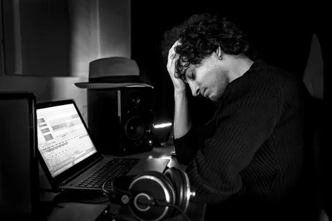 Frustrated Guy in studio during music production Stockfoto's