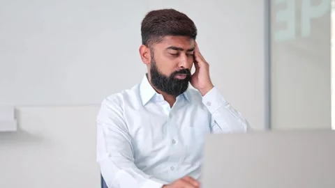 Frustrated Indian Professional Experiencing Headache Stock-Footage 314695589