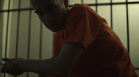 Frustrated Inmate stares at camera in a jail or prison Stock Footage 59759391
