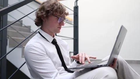 Frustrated IT specialist working on laptop Stock Footage 333974620