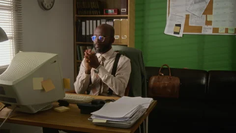 Frustrated Man Crumpling Paper and Looking at Retro Computer Screen Stock Footage 341420635