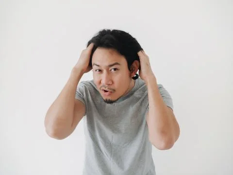 A Frustrated Man Expressing Deep Emotion in a Simplistic, Minimalist Settin.. Stock Photos