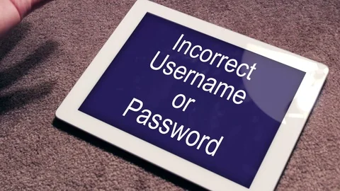 Frustrated man looking at a Incorrect Username or Password screen on T 스톡 동영상 70533730