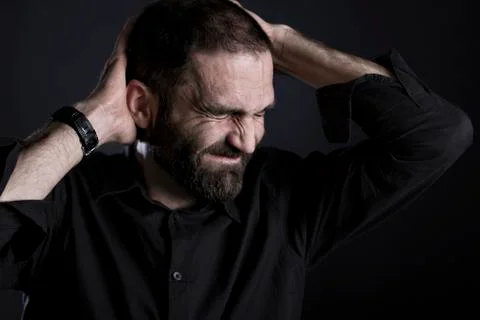 Frustrated man looking miserable and despaired. Stock Photos