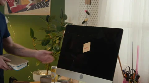 Frustrated Man Removing Sticky Note from Broken Computer in Student Dorm Stock Footage 336621637