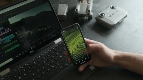 Frustrated man scrolling instagram while editing a video. Stock Footage 243426183
