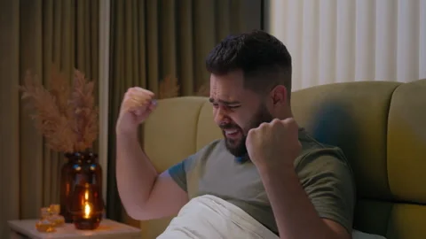 Frustrated man sitting bed screaming despair loss failure divorce separation Stock Footage 280254409