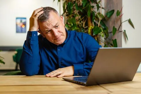 Frustrated Man Thinking Over Computer Task Stock Photos