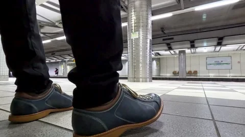 Frustrated man's feet on station platform. Stock Footage 243466901