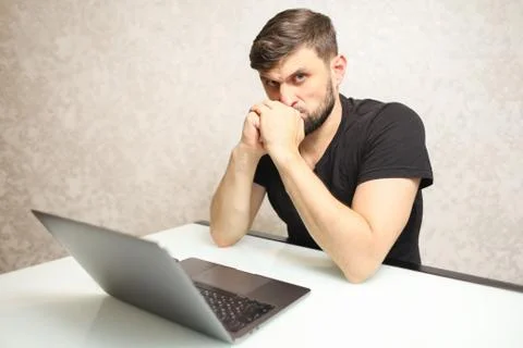 A frustrated person working at a computer Stock Photos