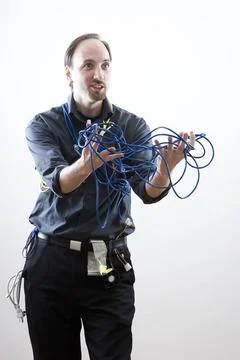 Frustrated by problem Computer technician looking exaperated showing netwo... Stock Photos