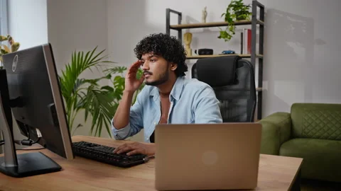 Frustrated programmer tries to find bug in source code Stock Footage 239332923