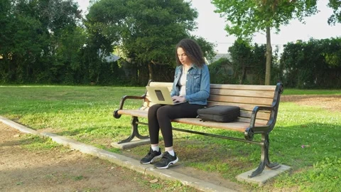 Frustrated Remote Worker Reacts to Difficult Coworker While Working Outdoors. Stock Footage 310576831