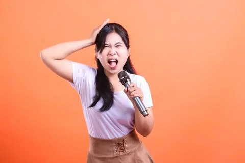 Frustrated Singer with Microphone Stock Photos