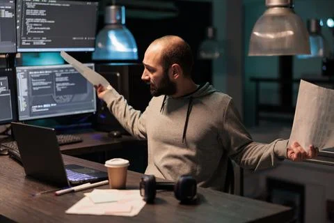 Frustrated software developer working late at night 写真素材