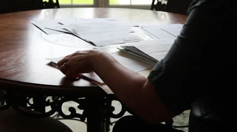 Frustrated with Stacks of Bills Stock Footage 31553370