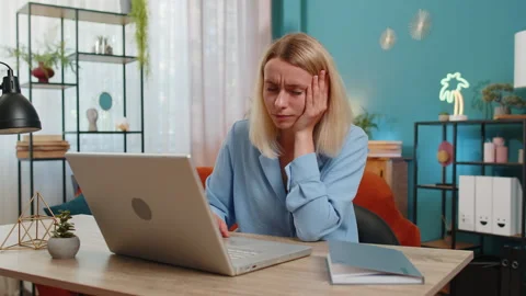 Frustrated woman having software problems with laptop angry girl nervous seeing Stock Footage 304809948