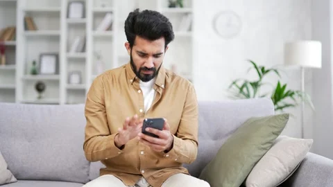 Frustrated young handsome bearded man having problems with software or service  Stock Footage 252201706