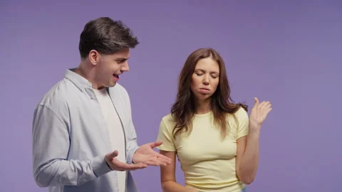 Frustrated young man arguing while woman dismisses his words with mocking blah b Video stock 341701637
