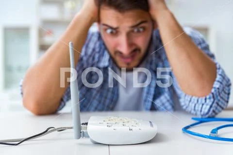 Frustrated young man due to weak internet reception Stock Photos