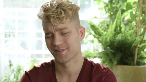 Frustrated young man shaking head at camera. 動画素材 88017995