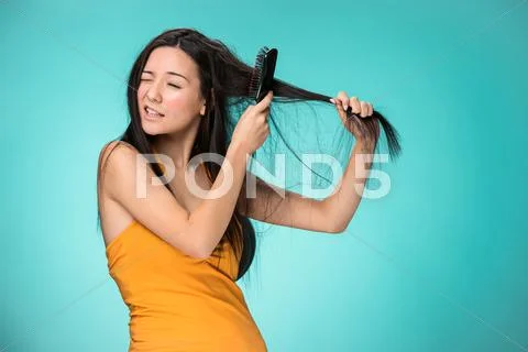 Frustrated young woman having a bad hair Stock Photos