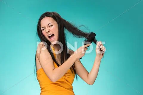 Frustrated young woman having a bad hair Stock Photos