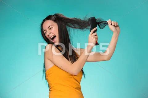 Frustrated young woman having a bad hair Stock Photos